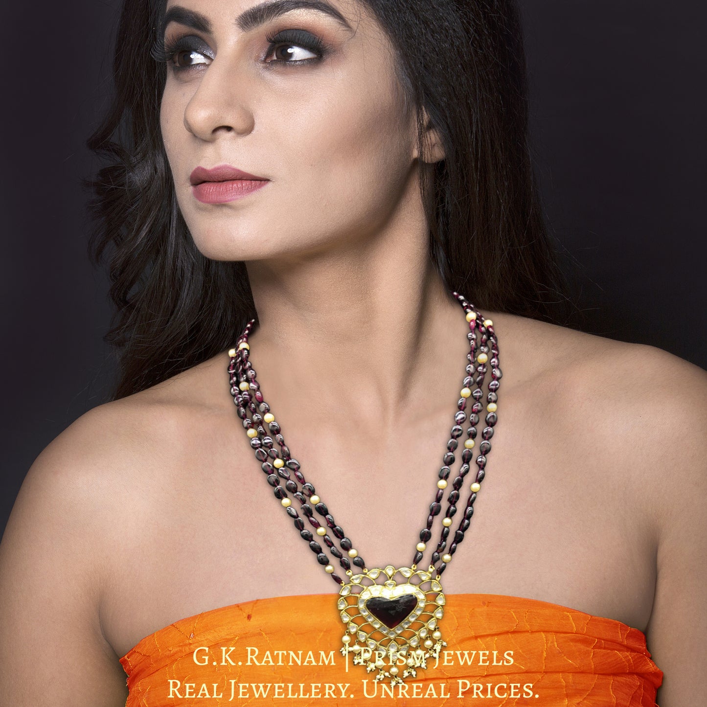 Traditional Gold and Diamond Polki heart-shaped Pendant Set with rhodolite center
