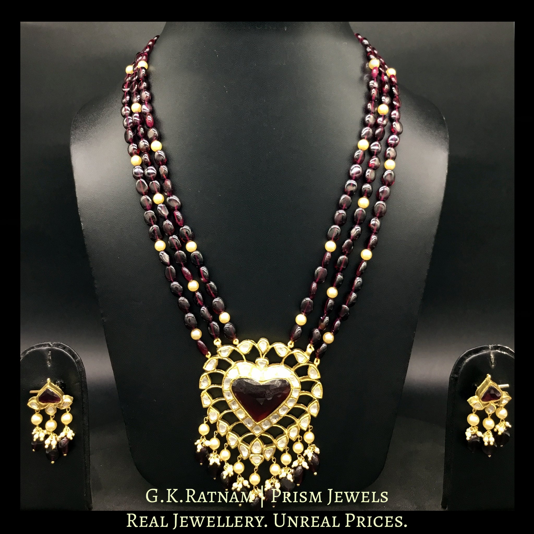 Traditional Gold and Diamond Polki heart-shaped Pendant Set with rhodolite center