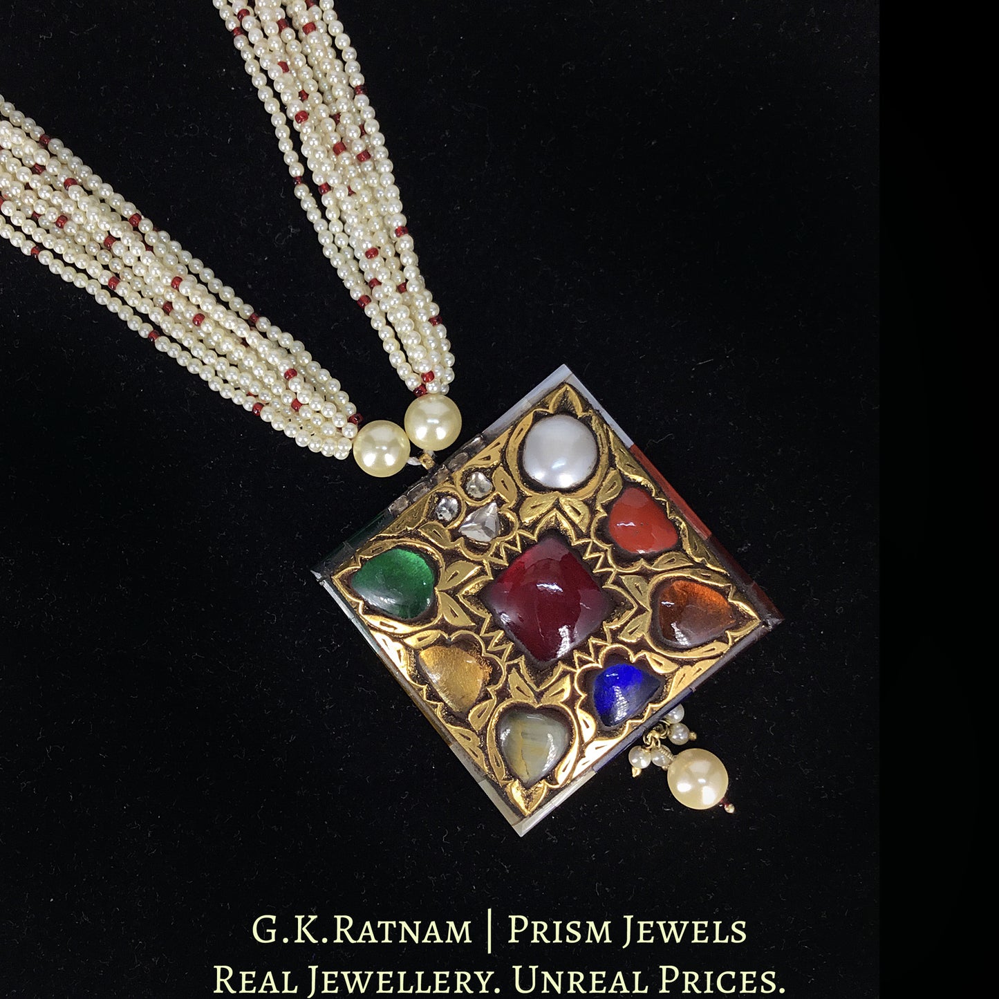 23k Gold and Diamond Polki Navratan Pendant strung in lustrous pearl bunches with a hint of red