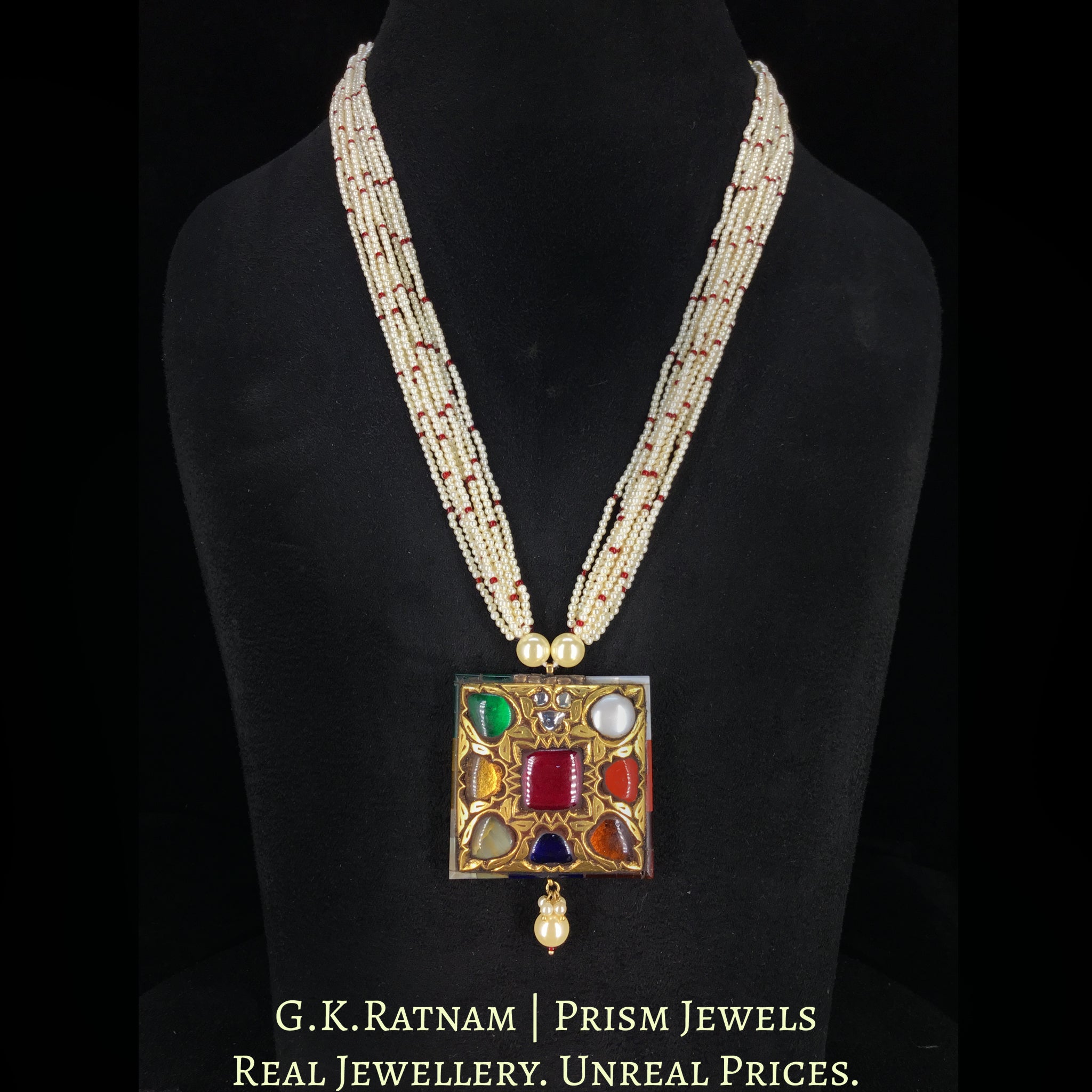 23k Gold and Diamond Polki Navratan Pendant strung in lustrous pearl bunches with a hint of red
