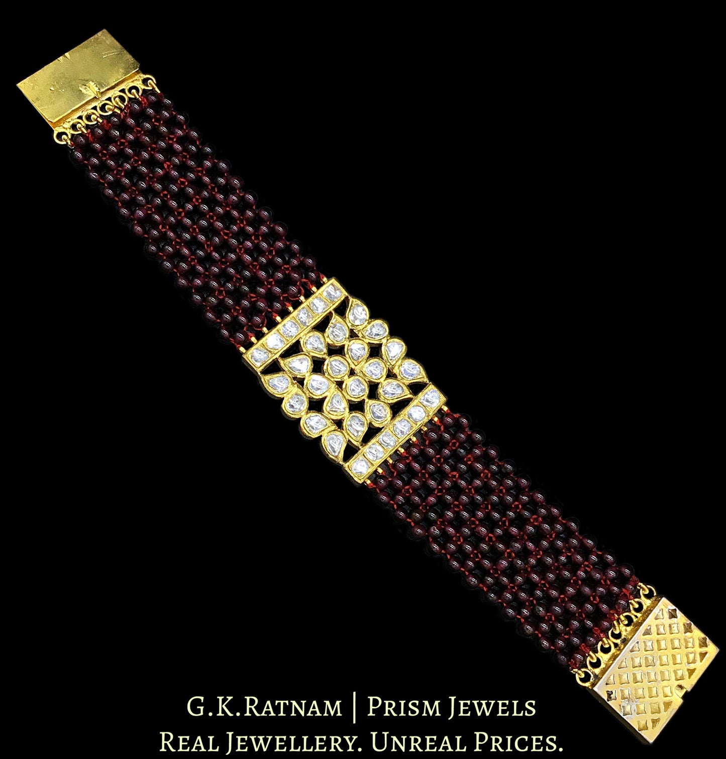 18k Gold and Diamond Polki Bracelet with ruby-red garnets strung like a Mat