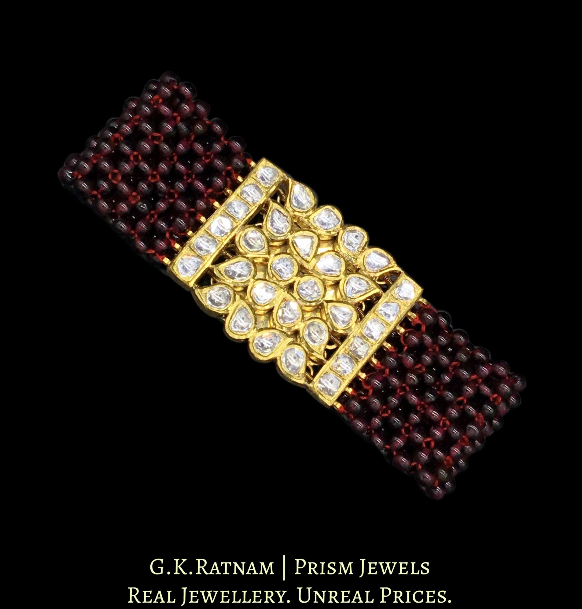 18k Gold and Diamond Polki Bracelet with ruby-red garnets strung like a Mat