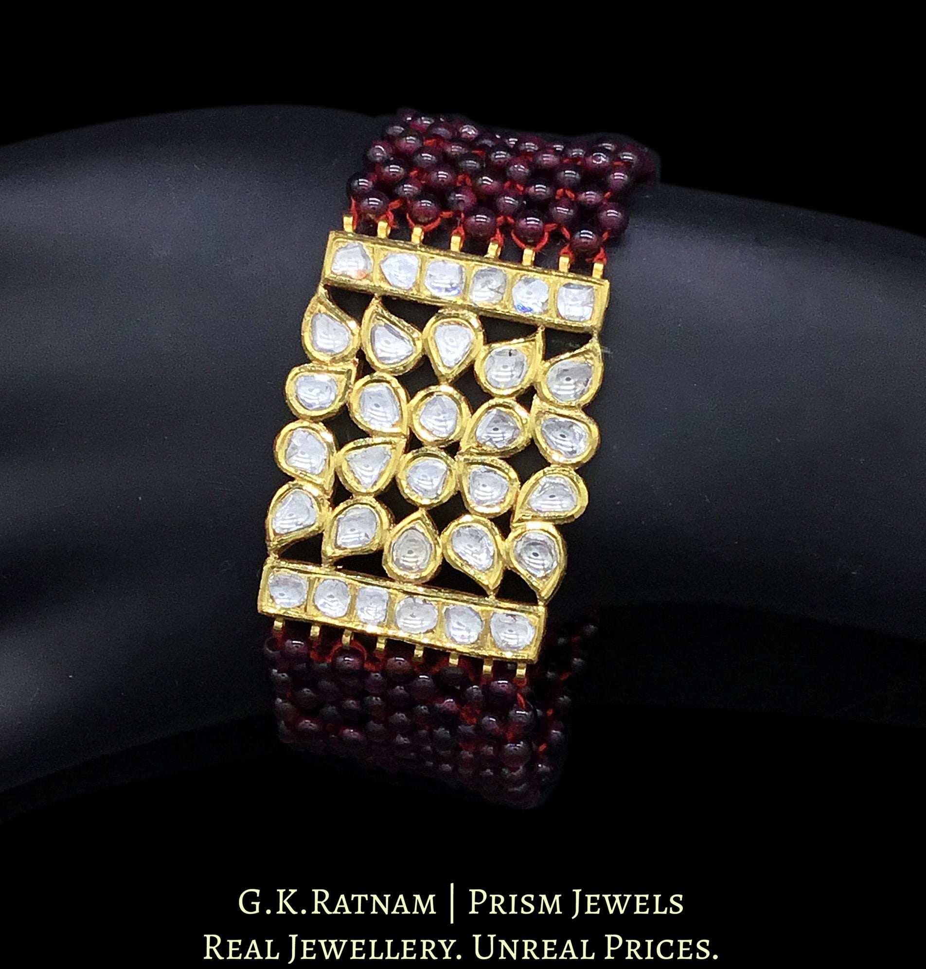 18k Gold and Diamond Polki Bracelet with ruby-red garnets strung like a Mat