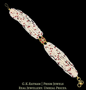 23k Gold and Diamond Polki Rakhi-cum-Bracelet with uncut surrounded by red stones