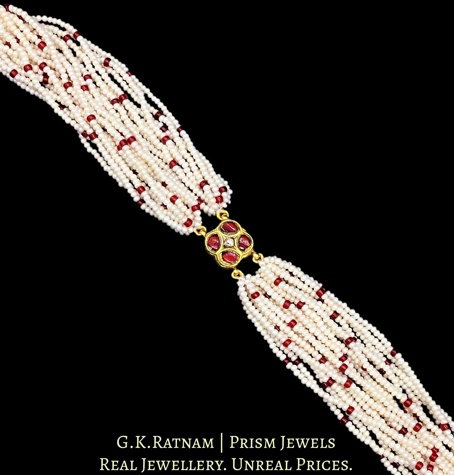 23k Gold and Diamond Polki Rakhi-cum-Bracelet with uncut surrounded by red stones